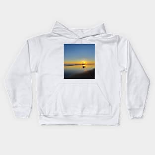 A silhouetted horse-drawn carriage on Parangtritis beach at sunset 4 Kids Hoodie